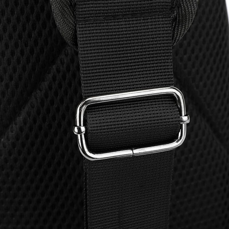 Close-up of a black crossbody bag's durable nylon strap with metallic buckle. Perfect for sports and daily adventures.